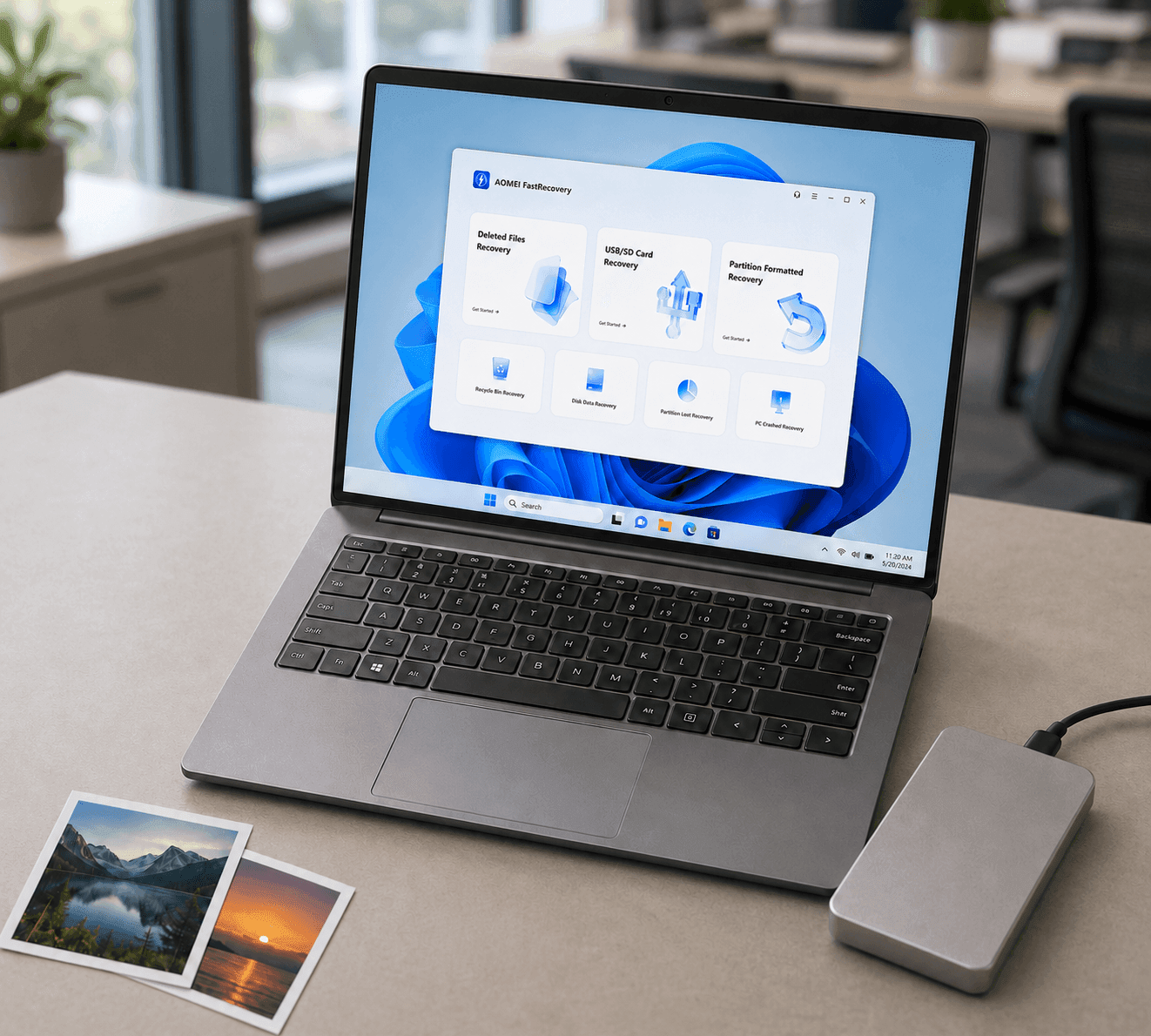 AOMEI FastRecovery en una laptop junto a un disco externo